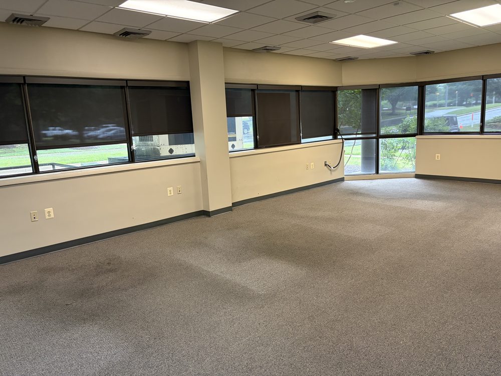 Empty carpeted office suite after a full commercial cleanout in Annapolis, MD