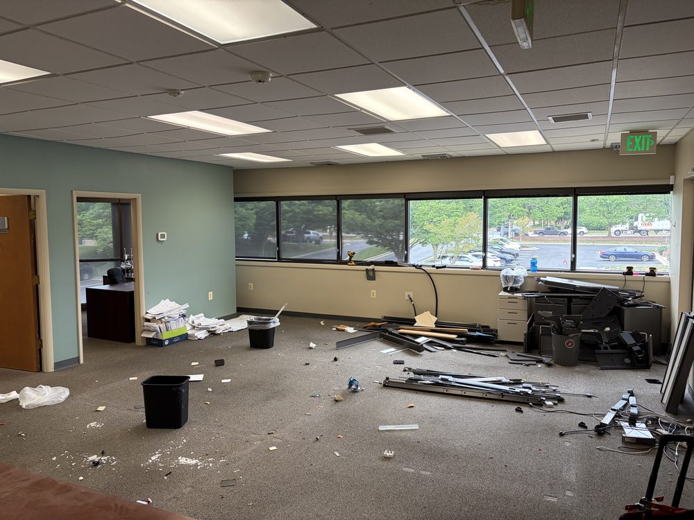 Two-story office floor full of cubicles and workstations before a commercial cleanout in Annapolis, MD