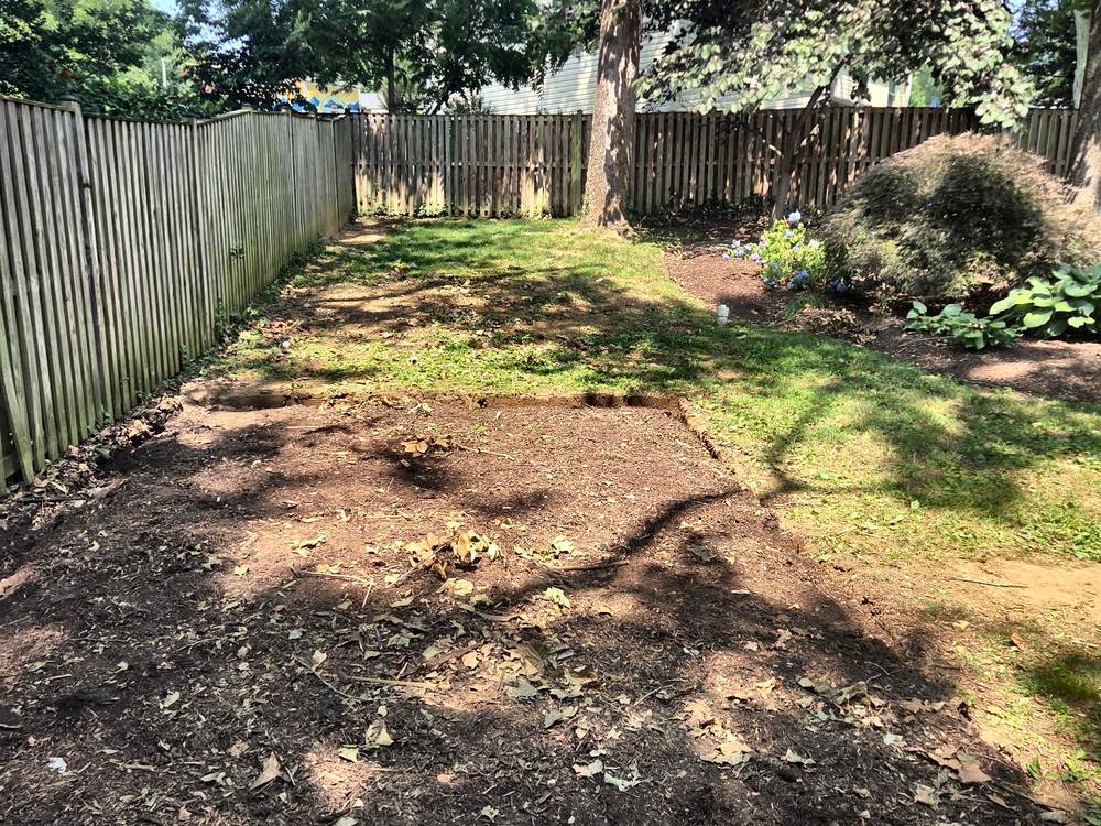 Cleared backyard where a wooden playset stood after removal in Arnold, MD