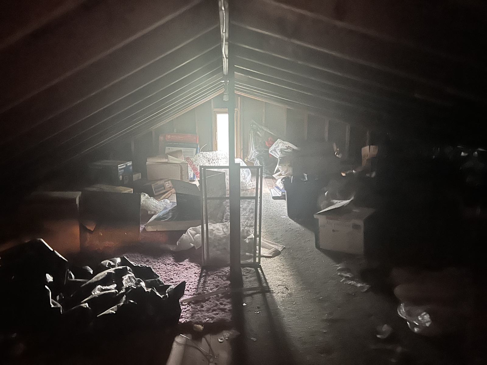 Cluttered low-clearance attic before MD Junk Pros cleanout in Central Maryland