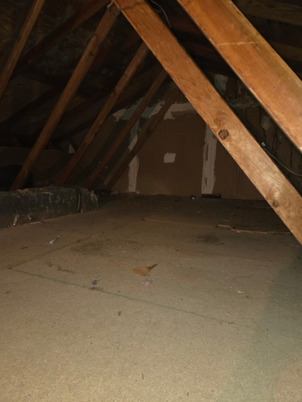 Open attic subfloor after MD Junk Pros cleanout in Central Maryland