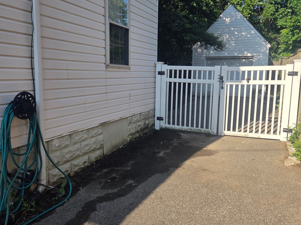 Clear side driveway with the pile hauled away after junk removal in Catonsville, MD