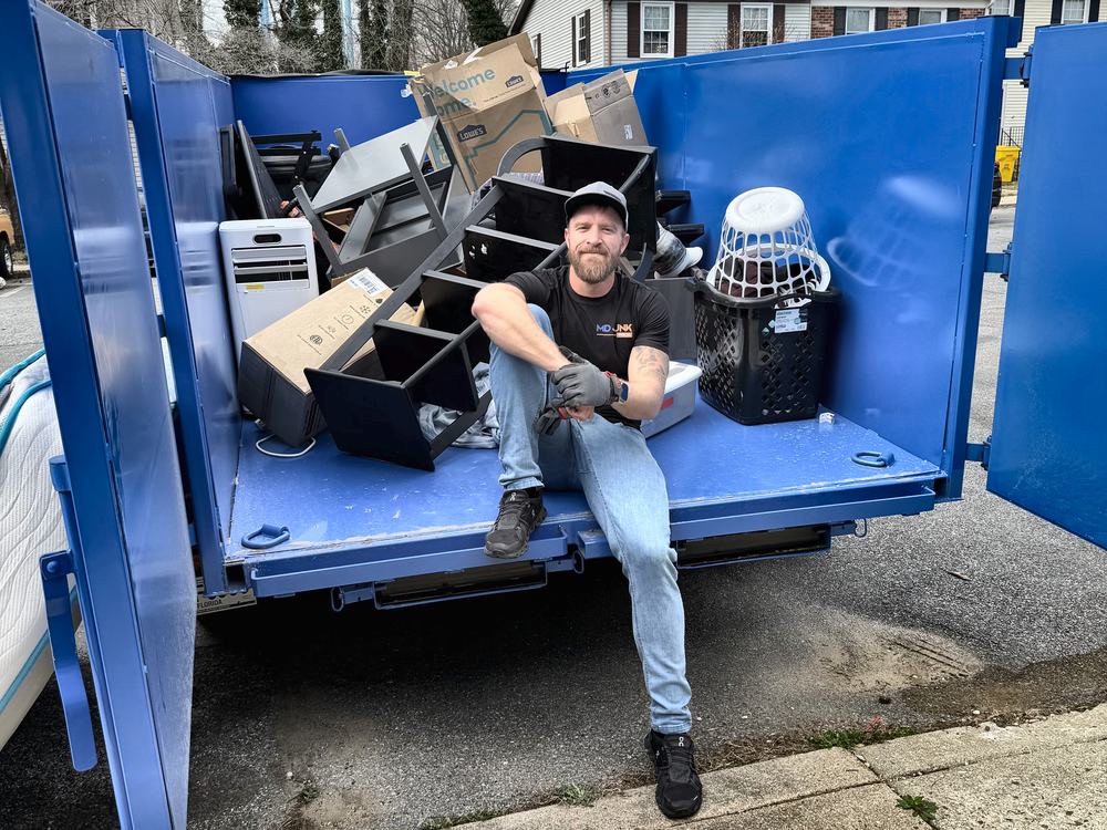 MD Junk Pros trailer loaded with furniture, boxes and a portable AC unit from a townhouse cleanout in Crofton Meadows, Crofton, MD