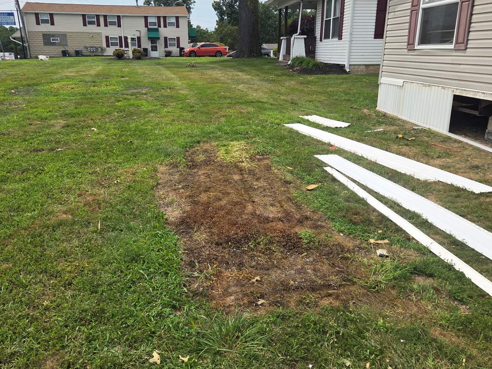 Same lawn cleared of construction debris after the haul-off on Washington Boulevard in Elkridge, MD