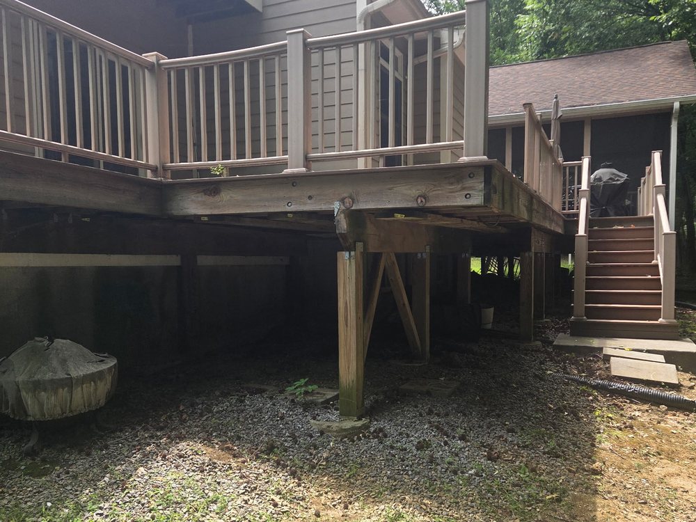 Cleared space under a raised deck with the loose cinder blocks hauled away in Fulton, MD