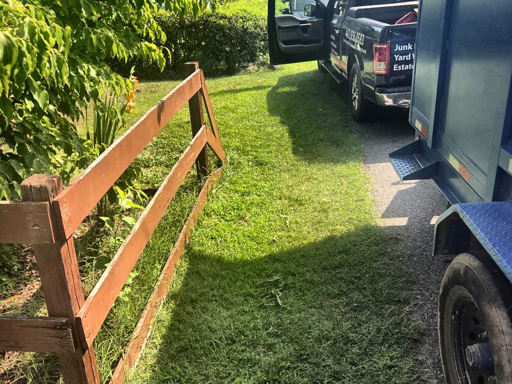 Same fence line cleared of bags after the trash pickup on Mound Street in Hanover, MD