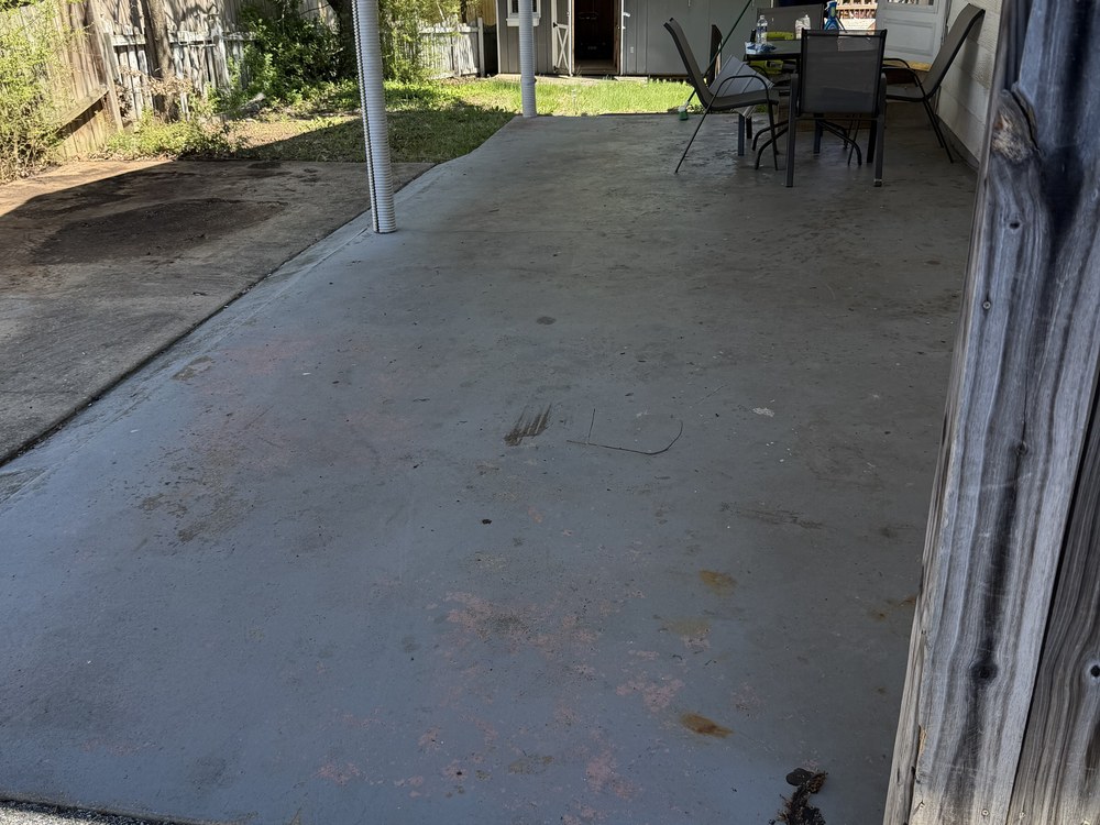 Same carport cleared to bare concrete after the cleanout on 11th Street in Laurel, MD