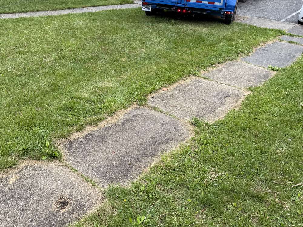 Same front yard cleared and swept with the MD Junk Pros truck hauling it away on Dove Court in Severn, MD