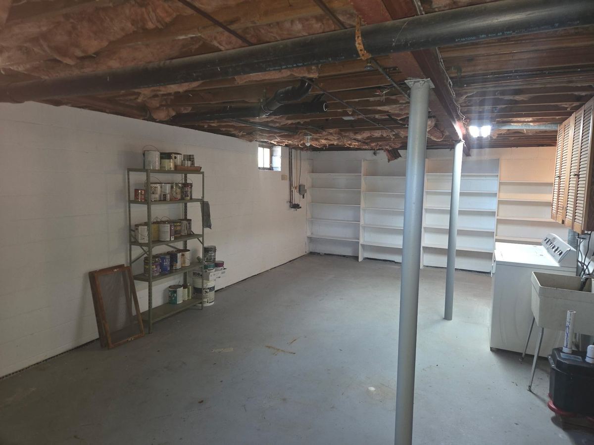 Cleared basement floor after a basement cleanout by MD Junk Pros in Severna Park, MD