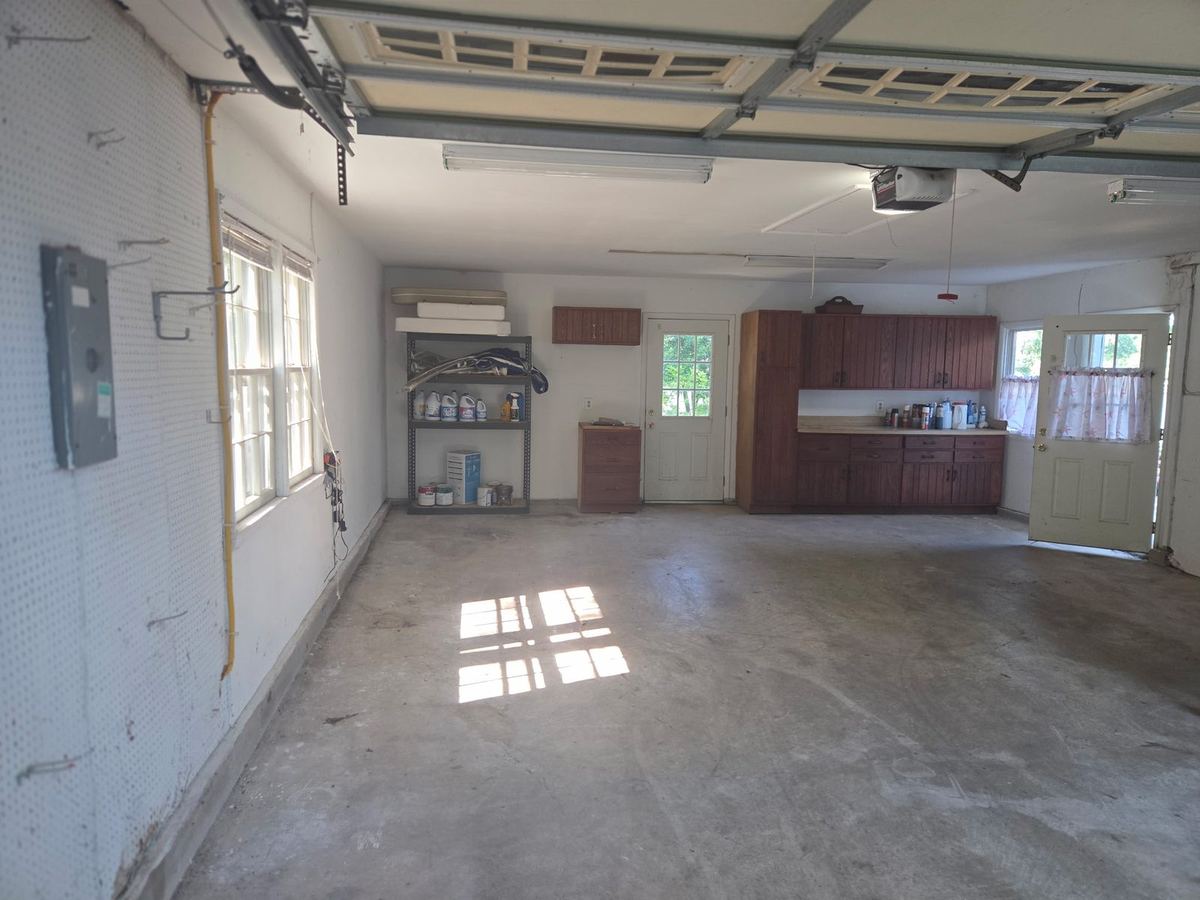 Empty swept garage after a full garage cleanout by MD Junk Pros in Severna Park, MD
