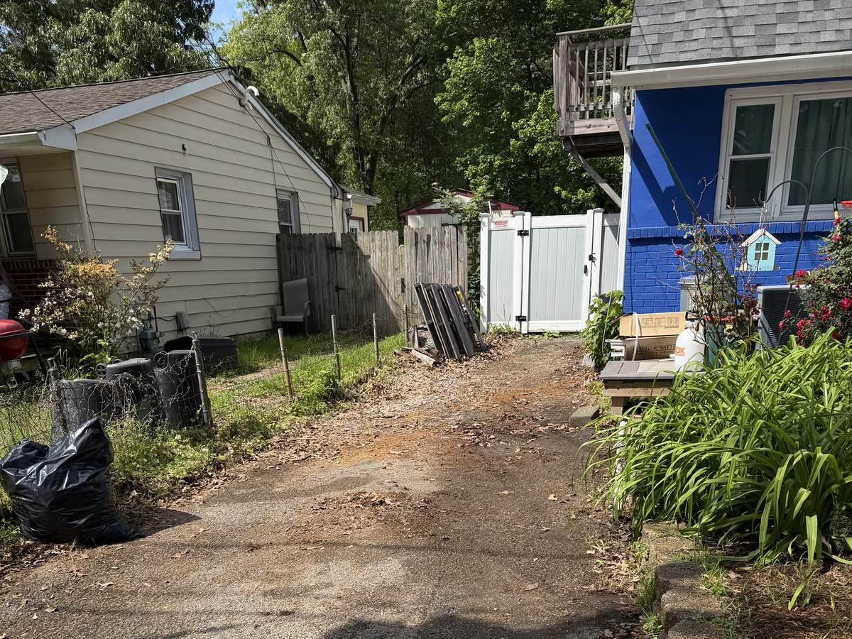 Cleared side driveway after shed demolition debris removal in Severna Park, MD